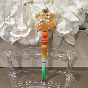 Cute Character Pen with Orange and Green Accents